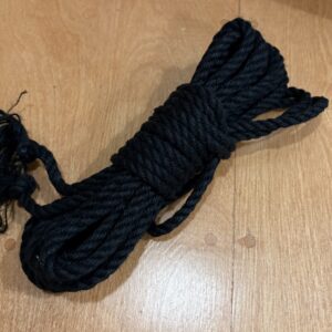 a single hank of dyed black jute rope