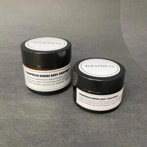 tubs of Paraphilia brand rope conditioning balm